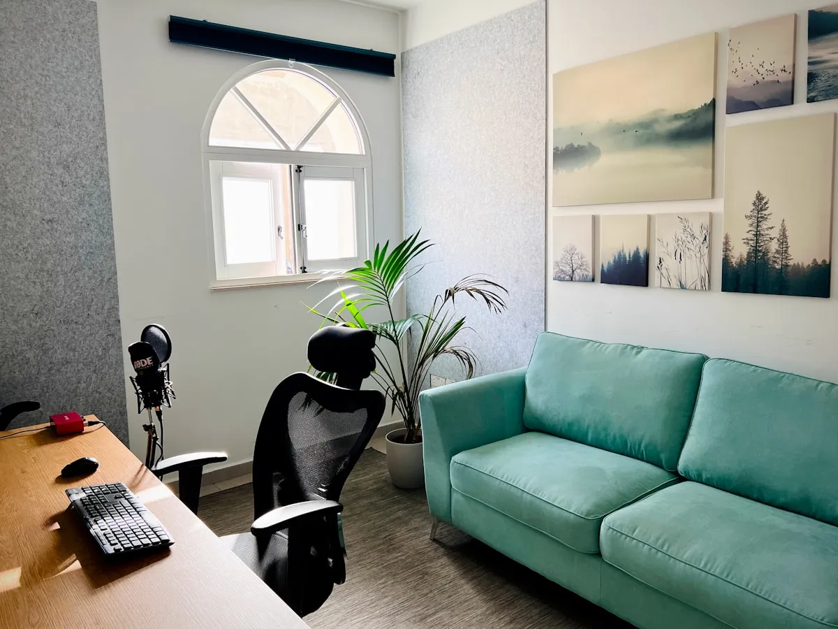 A therapy office with a couch and armchair