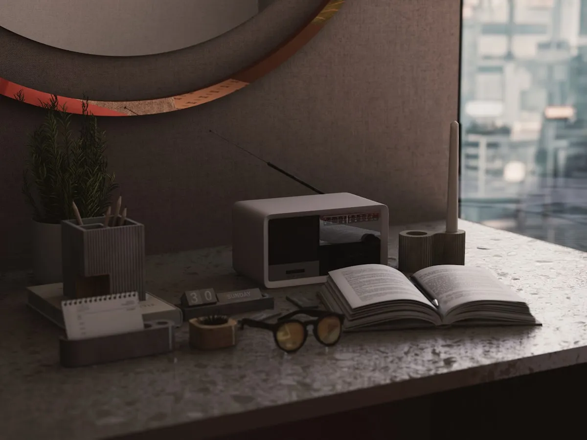 An open book and reading glasses on a desk